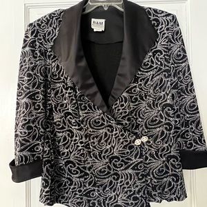 Beautiful formal top.  Pairs well with any black skirts of your choice.